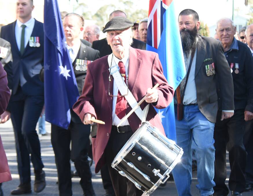 Lester keeping time on the snare drum in the 2021 Anzac Day march.