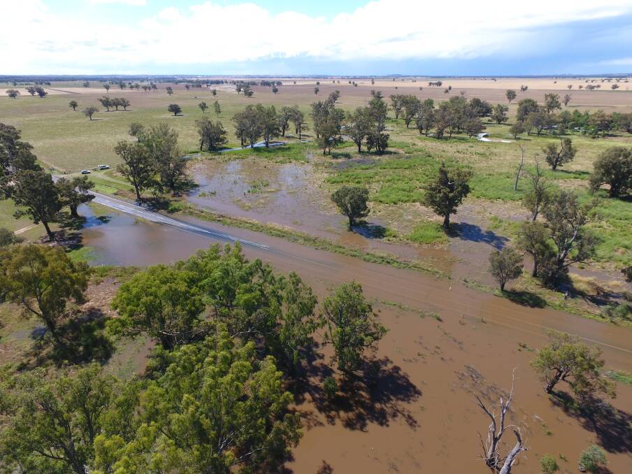 ROAD CLOSED: Craig Dwyer sent the drone up to capture the Escort Way - from Forbes to Eugowra - going under water on Sunday. Picture: Craig Dwyer