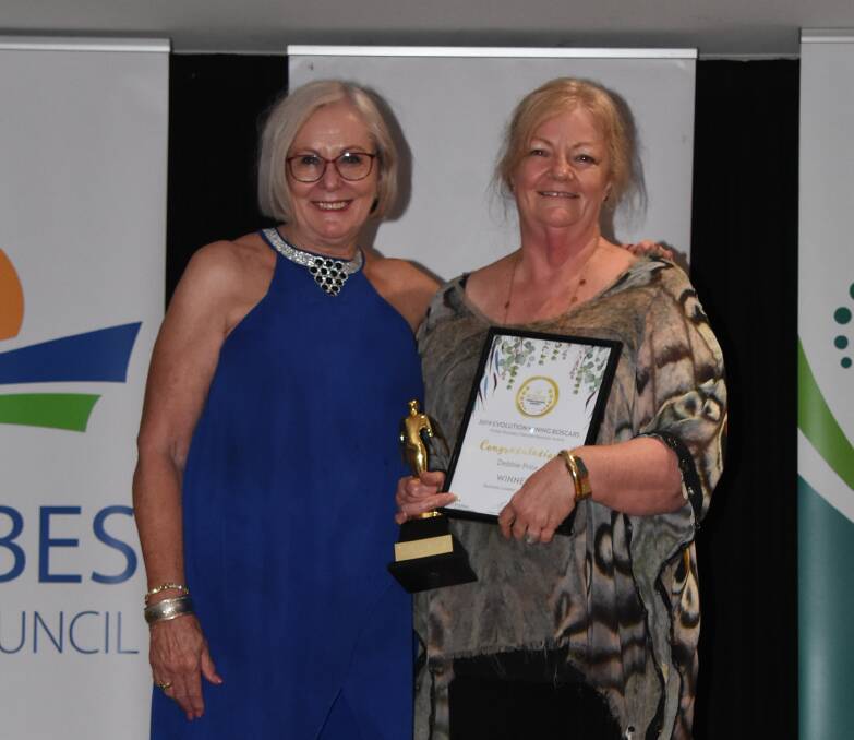 Mayor Phyllis Miller congratulates Business Leader of the Year Debbie Prior from Flannery's Pharmacy.