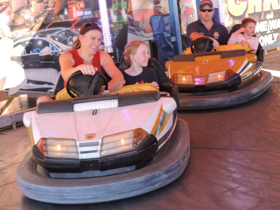Rachelle Hornery and daughter Maddison followed by Sam Hornery with daughter Danielle enjoyed the dodgem cars at the 2019 Eugowra Show. Organisers hope the event can return this year.