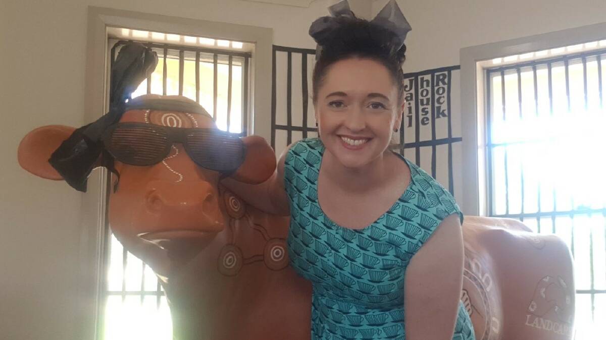 Marg Applebee and Geraldine the Landcare cow are all shook up for Elvis.