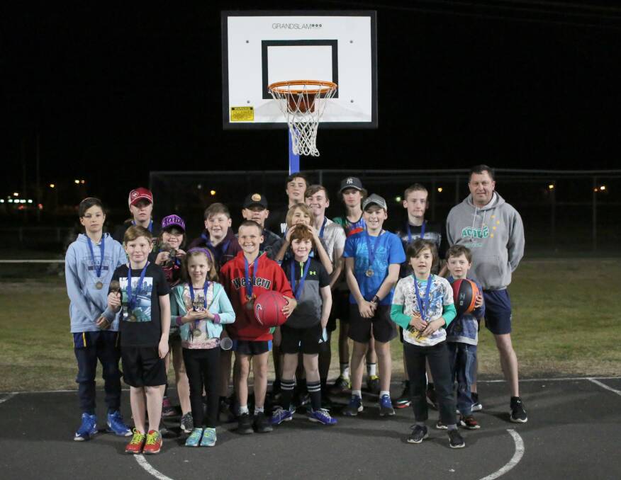 Young Forbes basketballers at the end of their winter competition with Grant Coles from Rock the Rim.