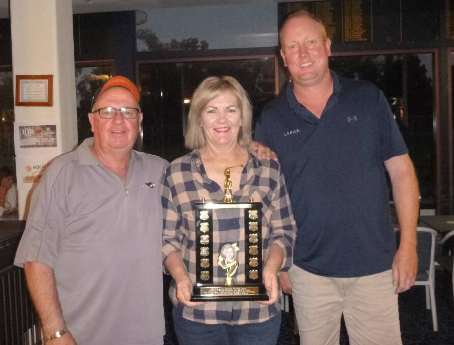 PRESENTATION: Terry Griffiths and Veronica Rebellato, sponsors of the Kristie Carpenter Memorial Trophy, with Club Captain John Betland. Picture: SUPPLIED
