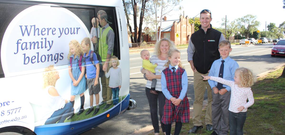 Nick and Jolene Jones with their children Griffin, Ruby, Ivy and Jimmy and the bus bound for Broken Hill. Photo courtesy Tricia Ward.