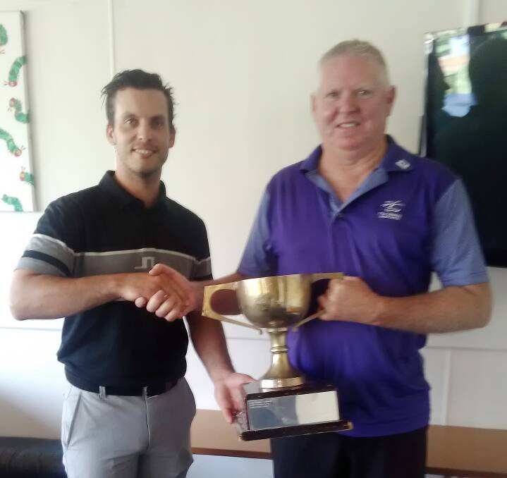 Head Pro Adam presenting the trophy to Peter Dawson, winner of the 2020 Medal of Medallists. Photo supplied.