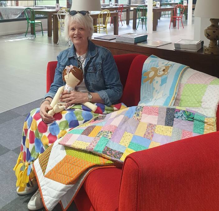 Miriam Melisi presented 30 quilts hand-made in Forbes to Ronald McDonald House Orange. Photo supplied.