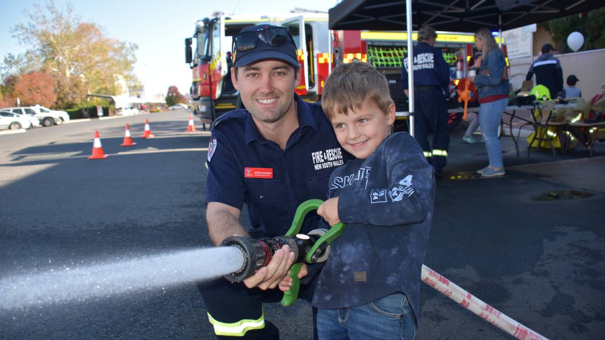 IT'S BEEN TOO LONG: Nick Morrison was helping Leo Whalan fight that fire in 2019 ... we'll be looking forward to joining firies at this open day after such a long break! Picture: FILE