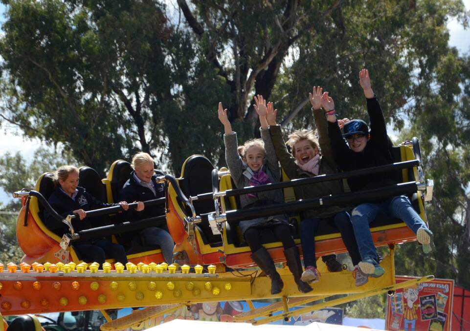 Showgoers enjoy the rides at Bedgerabong in 2017.