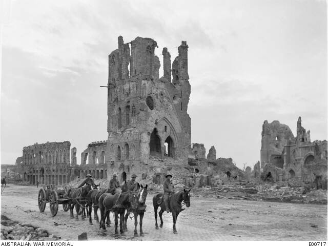A loaded limber passing the ruins of the Cloth Hall at Ypres. Photo Australian War Memorial collection AWM E00717.