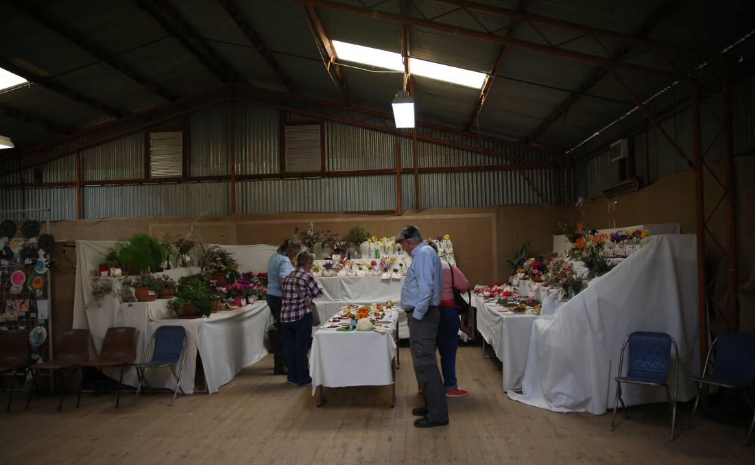 Visitors admire the pavilion exhibits at the 2018 Eugowra Show, but the event will not go ahead this year with concerns about coronavirus again on the increase. File photo.
