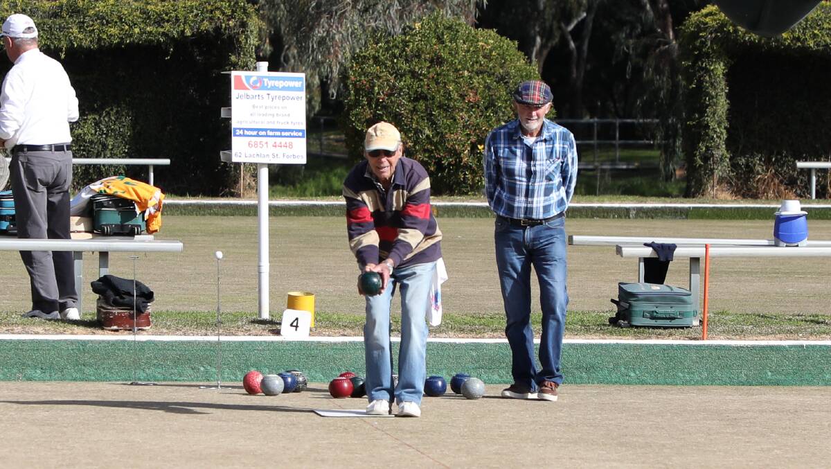 ON A ROLL: John Baass sends his bowl down in competition on a sunny Saturday. 
