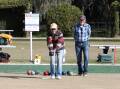 ON A ROLL: John Baass sends his bowl down in competition on a sunny Saturday. 