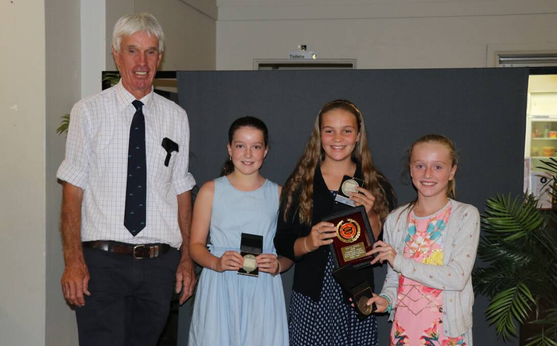 Andrew Norton-Knight presented the President's Award to the Forbes Public swim relay team including Jade McKeown, Tess Worland and Louie Hodder.