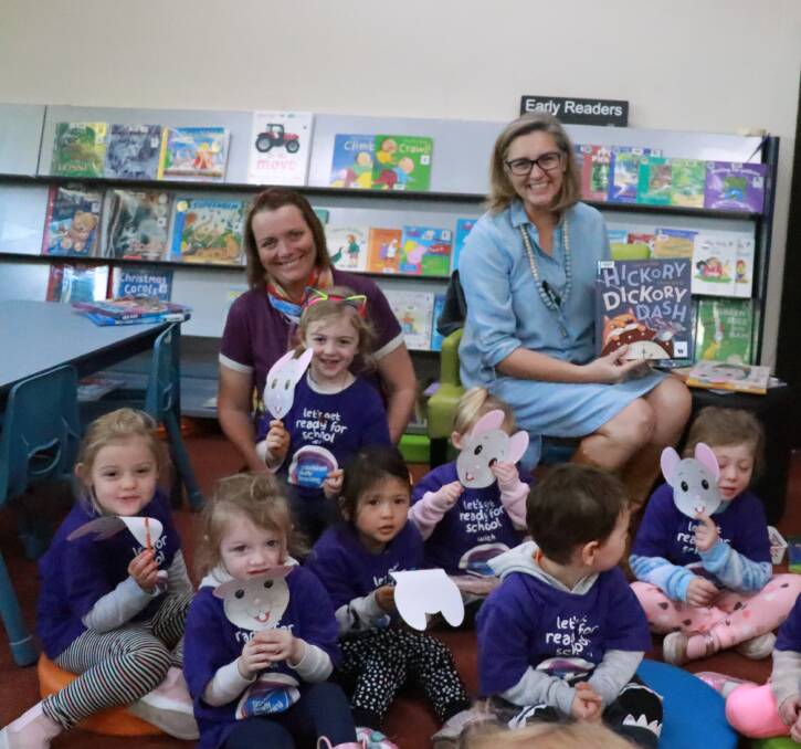 Kath Garland and Goodstart Early Learning children at storytime last year.