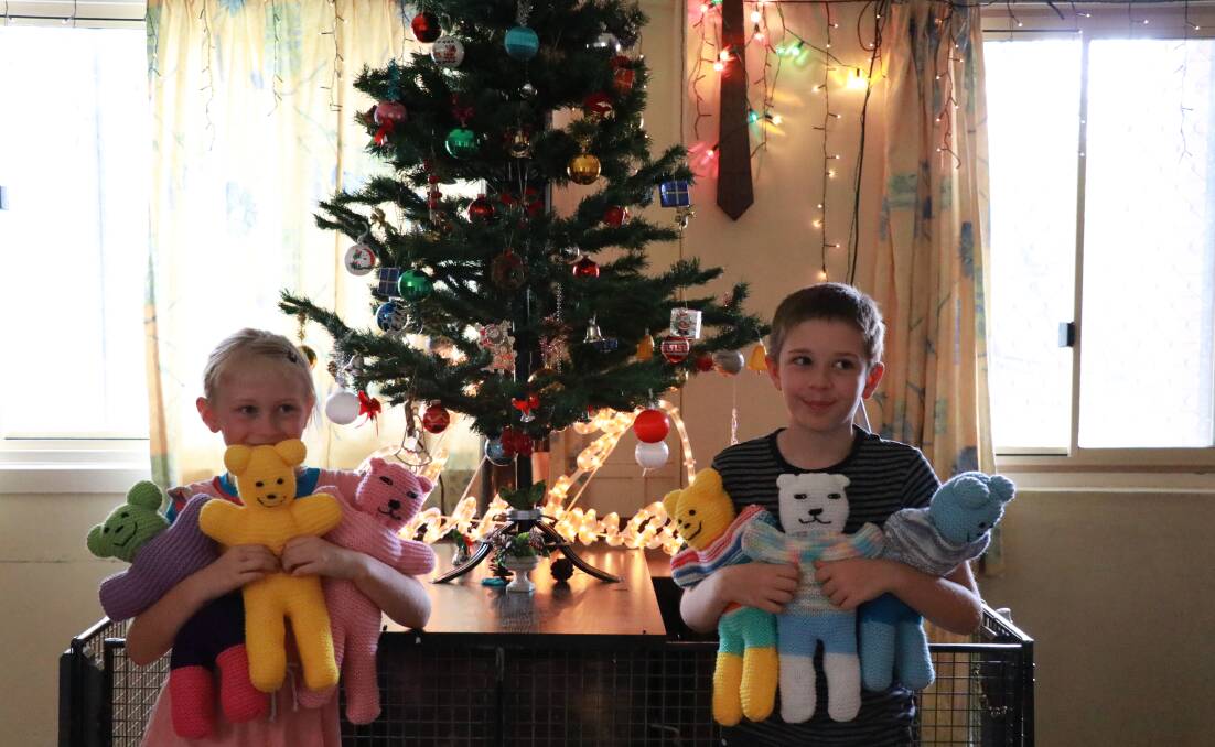 Aurelia and Patrick Virtue with some of the cuddly toys donated for Christmas gifts. 