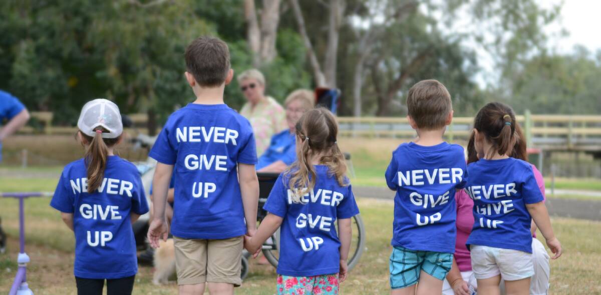 Never give up: that's the message from these little walkers at a previous Forbes Walk to D'Feet Motor Neurone Disease. 