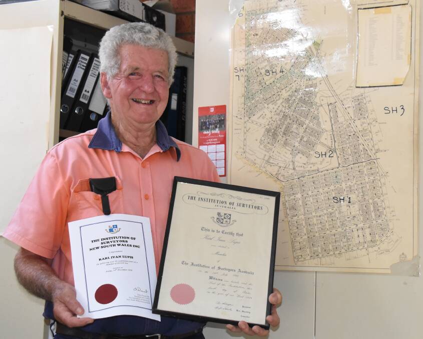Surveyor Karl Lupis with his original Institution of Surveyors certificate and his acknowledgement of more than 50 years membership. 