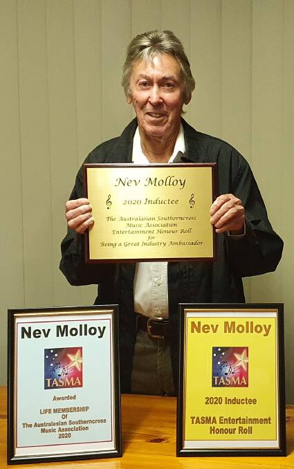 Nev Molloy with his honours from The Australasian Southerncross Music Association. Photo courtesy of Nev.