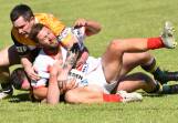 Trundle's Mitch Dinsey tackles Manildra's Luke Petrie. Picture by David Ellery