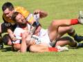 Trundle's Mitch Dinsey tackles Manildra's Luke Petrie. Picture by David Ellery