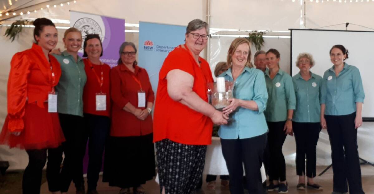 Rural Women's Gathering Chairperson Di Gill, Secretary Marg Applebee, Catriona McAuliffe and Caron Chester in red with the Walcha RWG Committee at handover.