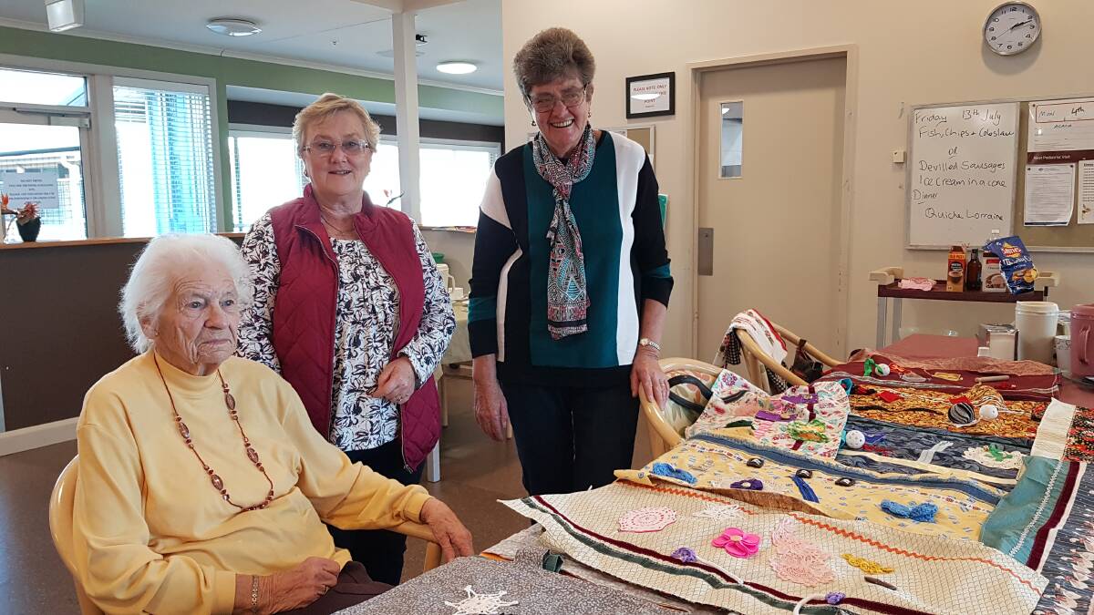 Joan Bains, Zelma Grayson and Elaine Bright with the tray mats at JRV.