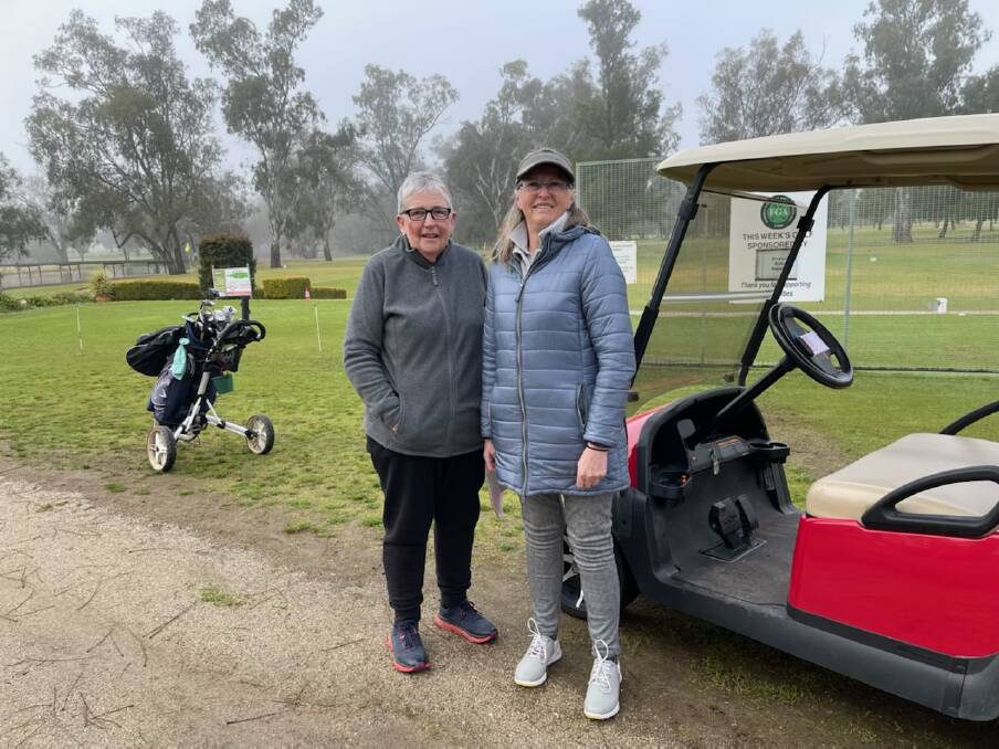 FOGGY START: Judy Hodge and Kerry Stirling ready to head out on the course on Wednesday morning. Picture: BEC BENNETT