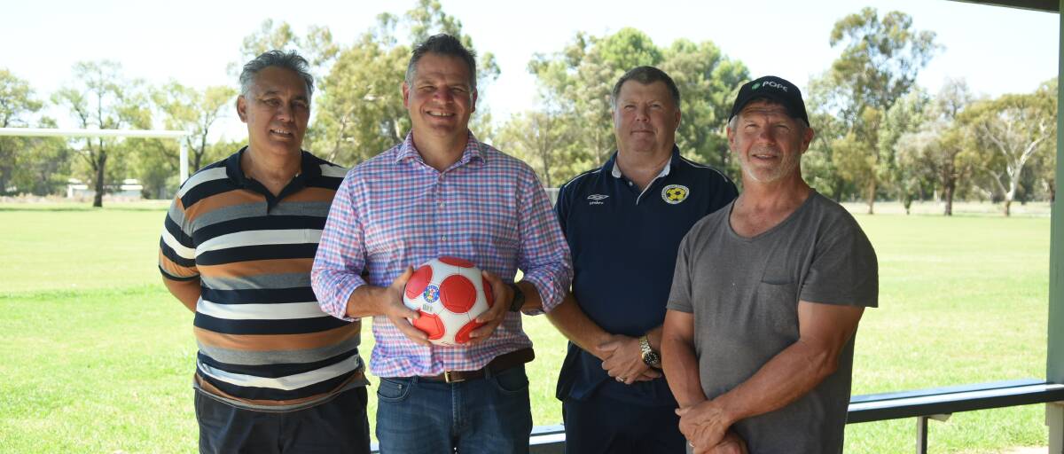 Phil Donato with Doug Mckenzie from Forbes and District Soccer, Cr Steve Karaitiana and Cr Jeff Nicholson.
