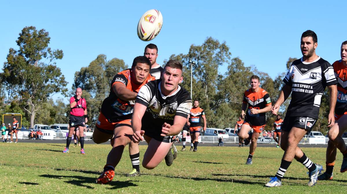 CATCH THE ACTION: Forbes will host rugby union and rugby league semi-final action on Saturday. Magpies player Ethan Gaffney is pictured firing a pass to his support.