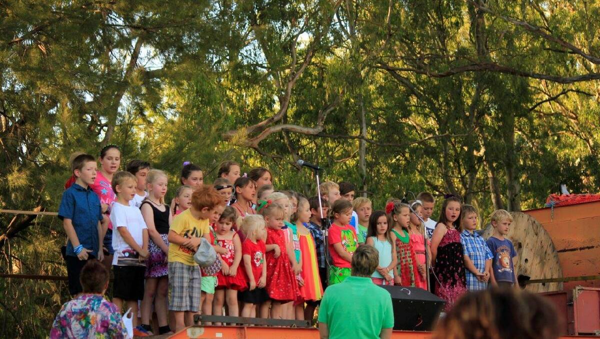 Children singing at Eugowra's picturesque Carols by the Creek in 2015.