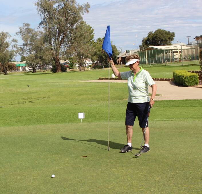 Looking Good: Marie Reid watches a putt roll in. Winners were Colleen Venables and Marie Reid with 74 ¾.