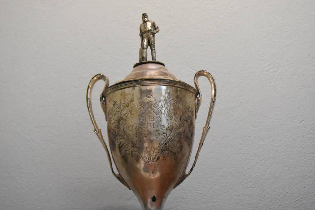 The historic Grinsted Cup, with the figure of the renowned English cricket WG Grace on top.