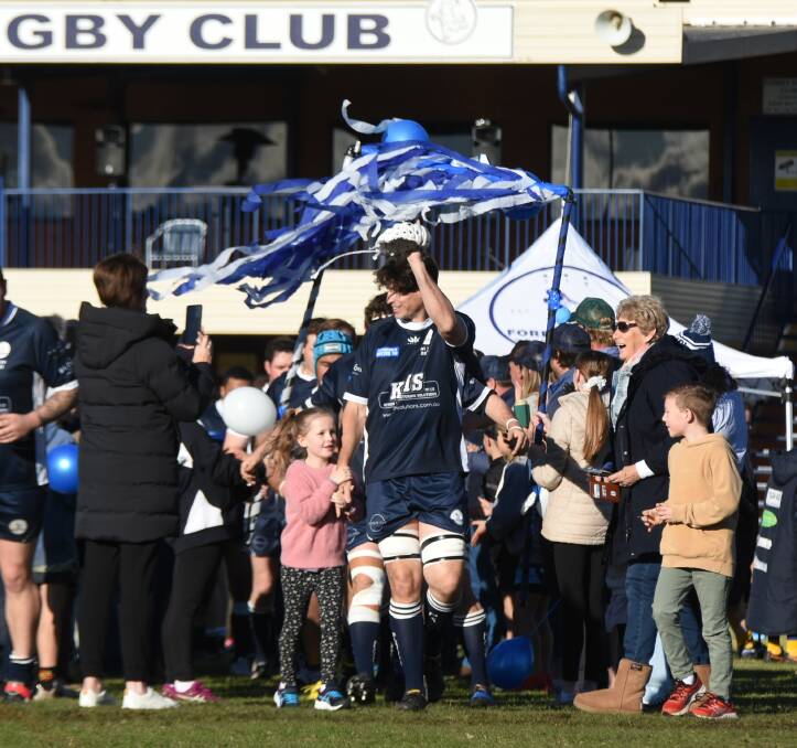 Players, supporters and family formed a guard of honour for Andrew Hubbard as he led the Platypi on to the ground for his 400th senior game with Forbes Rugby Club.