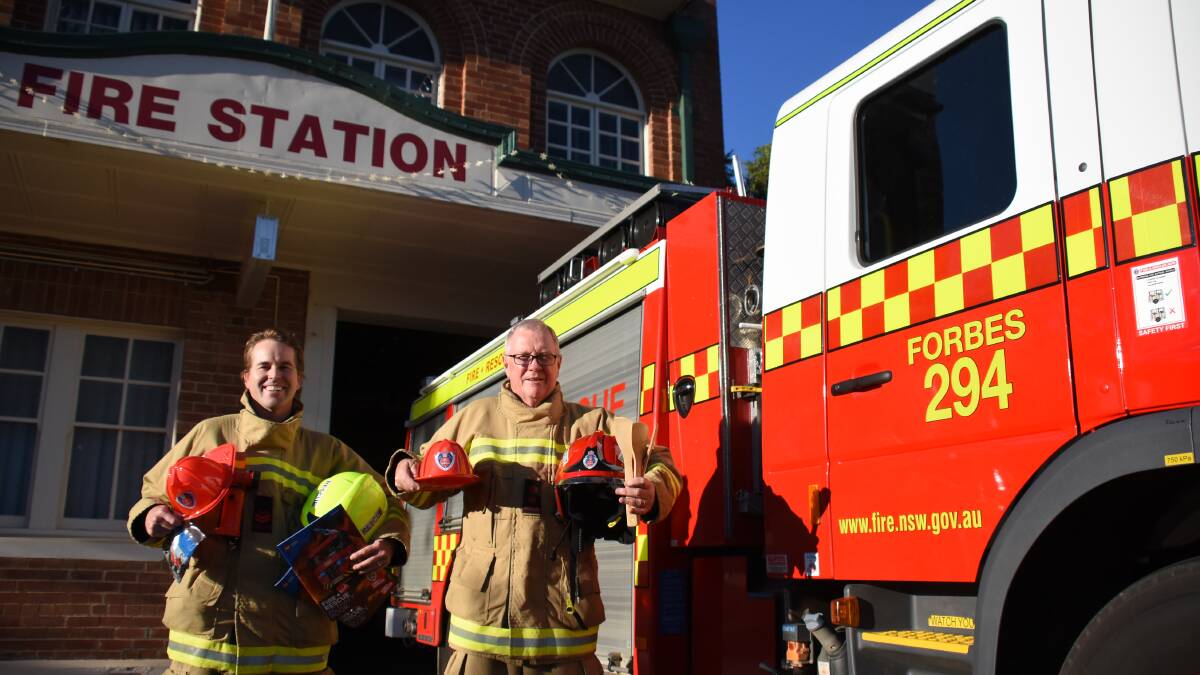 Local firefighters Mat Teale and Brian Clarke encourage families to join them this Saturday for the annual open day.