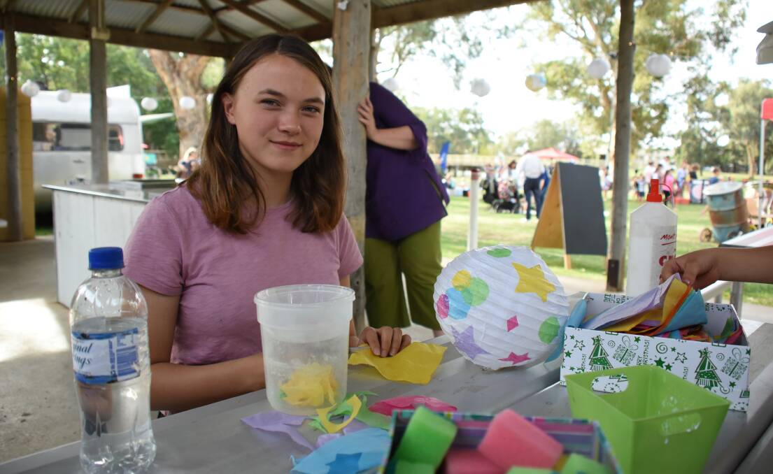 Ruby Shannon decorating lanterns to light up Victoria Park for the River Arts festival at the Youth Week celebrations last month.