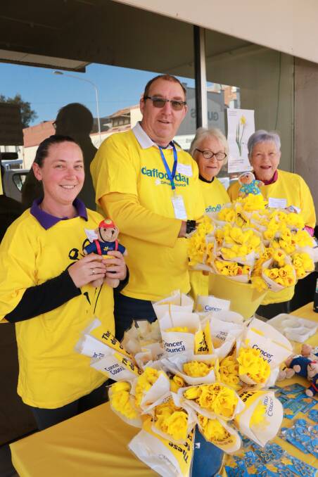 Forbes Lions Nelly Dukes, Graham Williams, Cherylin Cole and Pam Stevens supporting the Cancer Council by selling Daffodil Day merchandise in 2018.