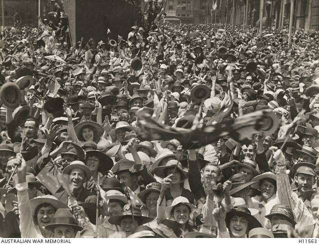 Crowds celebrating the signing of the armistice in Martin Place, Sydney. Photo from the Australian War Memorial collection.