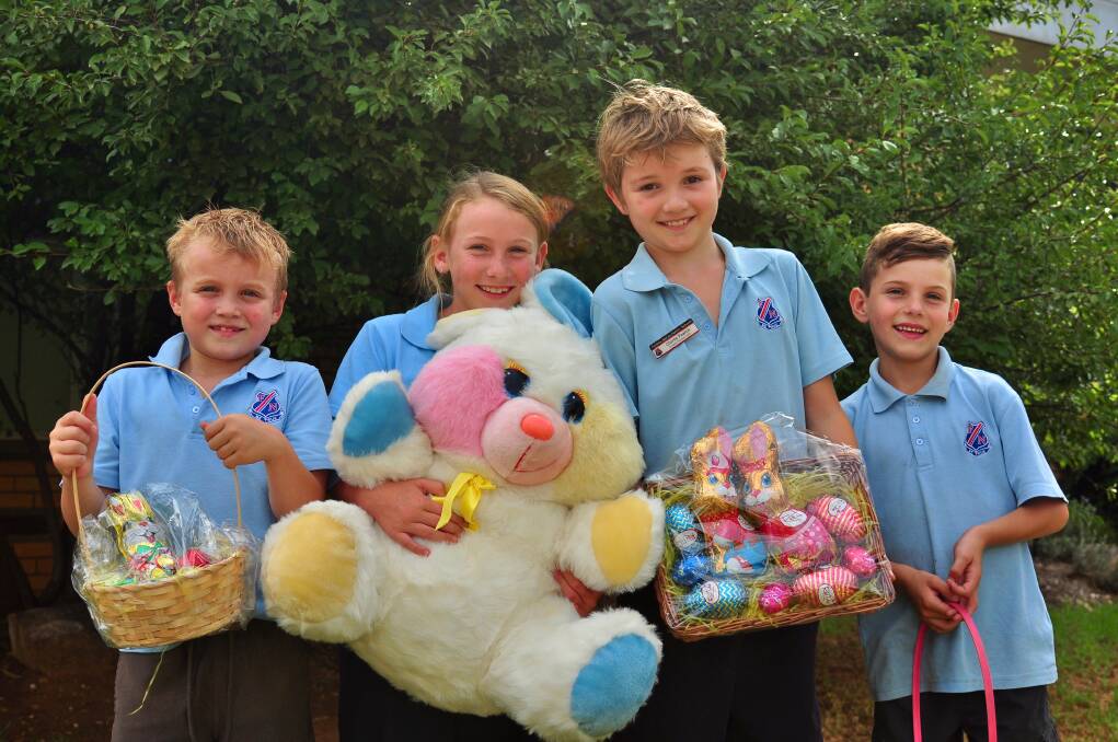 Charlie Bridge, Charlotte Markwort, Charlie Pearce and Jackson Markwort are all set for Easter fun at the Forbes North fete. Photo supplied. 