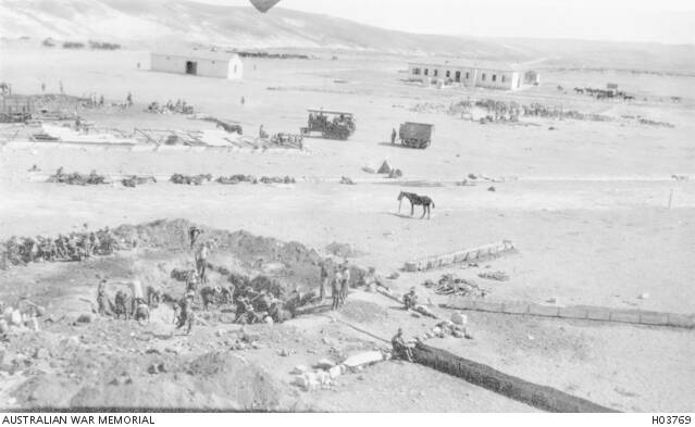 A Light Horse unit digs to locate a water supply outlet at Asluj. Photo Australian War Memorial.