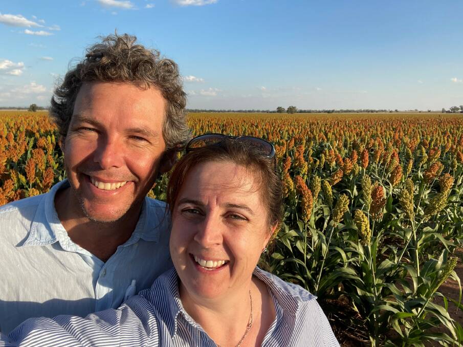 Mark and Katrina Swift with last season's sorghum crop at Nelungaloo.