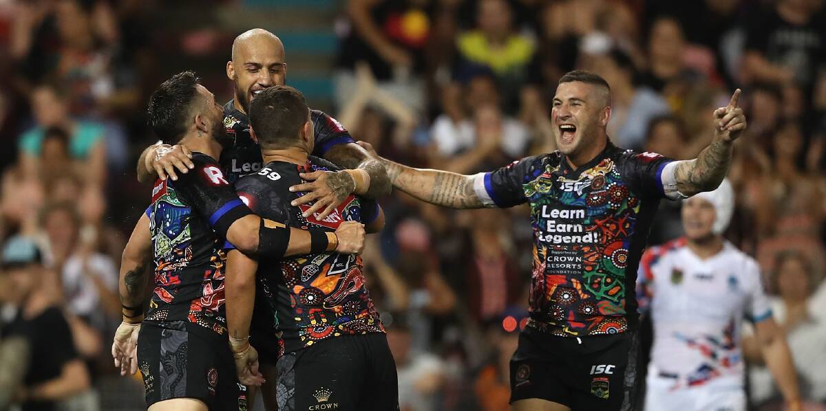 INCREDIBLE NIGHT: Forbes' Joel Thompson, far right, celebrates after setting up his side's first try. Photo: GETTY