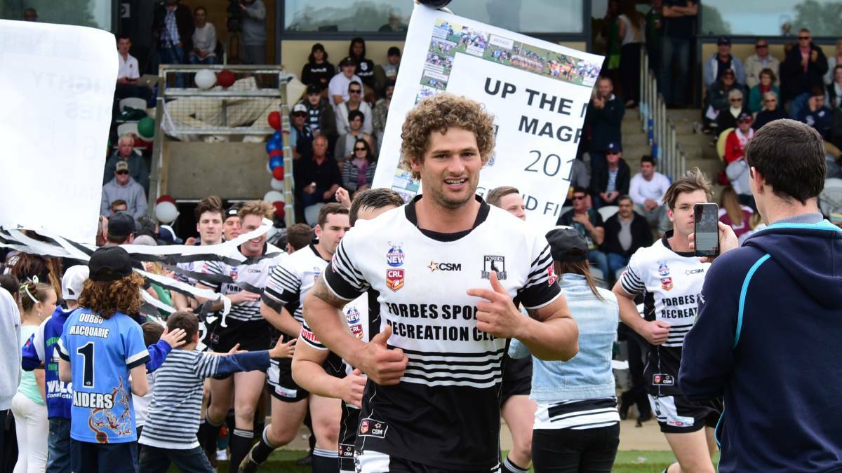 BACK IN THE DAY: Jake Grace leads the Magpies out in 2016. 