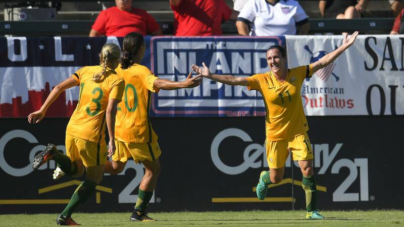 Australia's Lisa De Vanna, right, celebrates with teammates Temeka Butt, left, and Sam Kerr. Photo:  Mark J Terrill, AP
