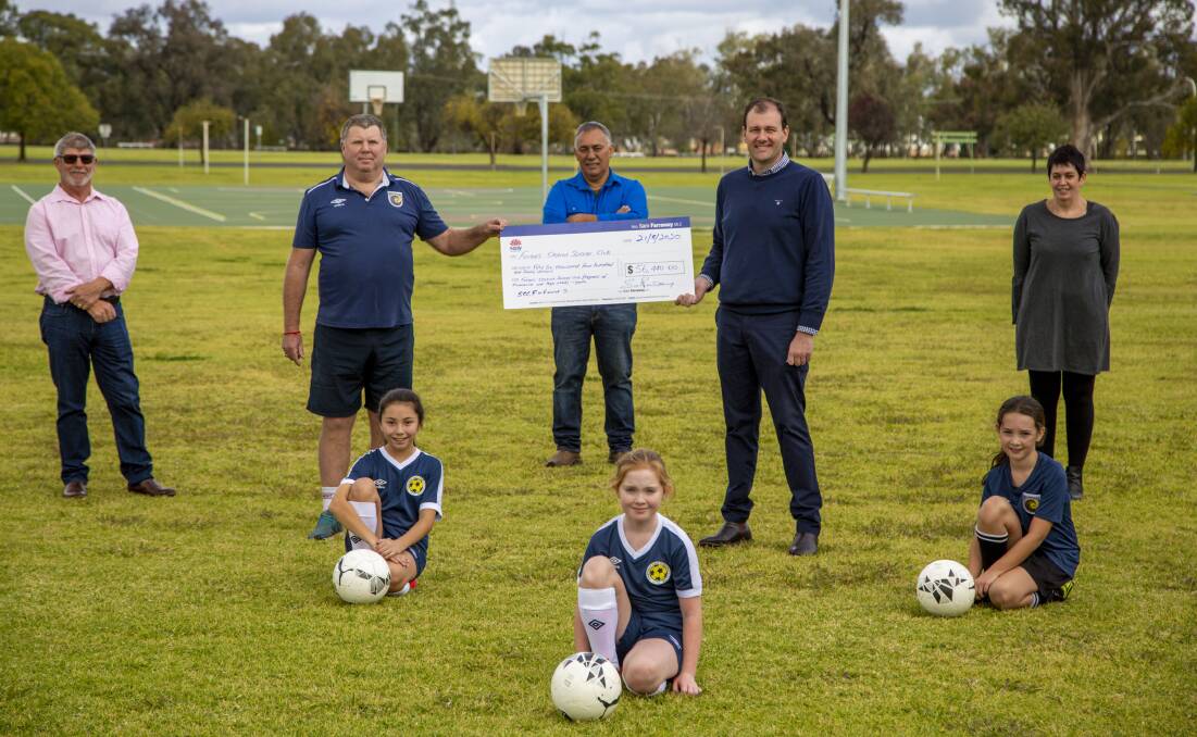 Nationals Upper House MP, Sam Farraway presenting a cheque for $56,440 from the NSW Governments Stronger Country Communities Fund to the Forbes and District Soccer Club. 