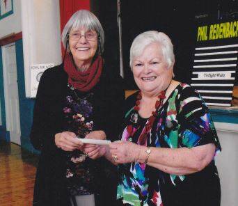 Lorraine Lowe presenting the cheque to Grace Hosking, Treasurer of Royal Far West Children's Health Scheme Trundle Branch.