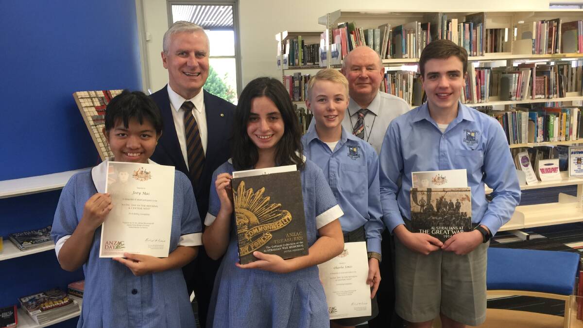 Forbes Red Bend Catholic College participants (front, from left) Joey Mai, winner Sienna Emseis, Charlie Jones and highly commended recipient James Finn, with Member for Riverina Michael McCormack and Red Bend Principal Brother Michael Flanagan.