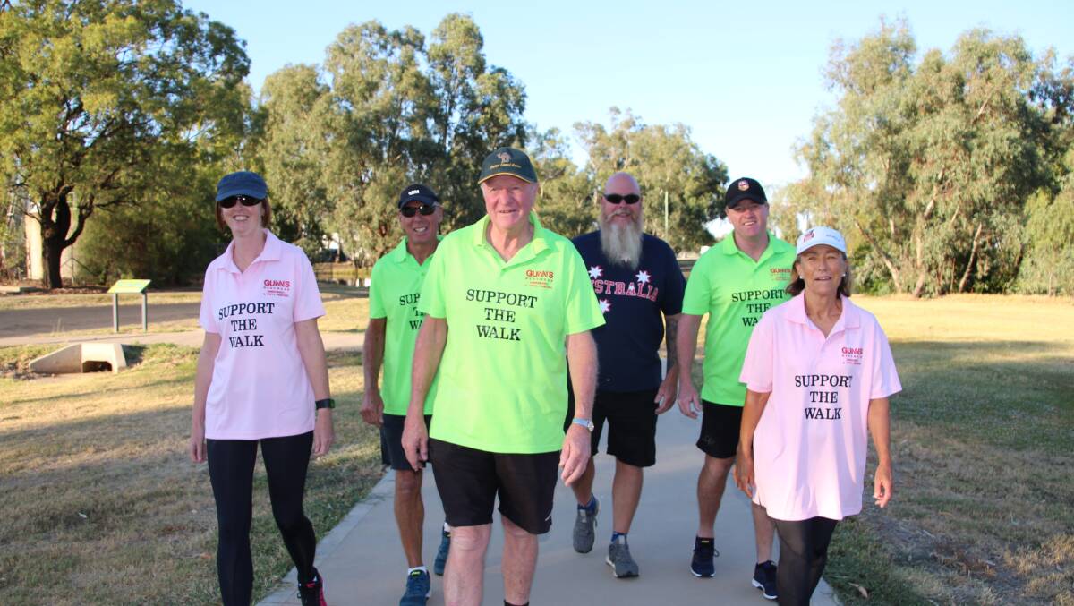 Kerry Dunstan (centre) will arrive in Forbes this evening after walking from Condobolin.