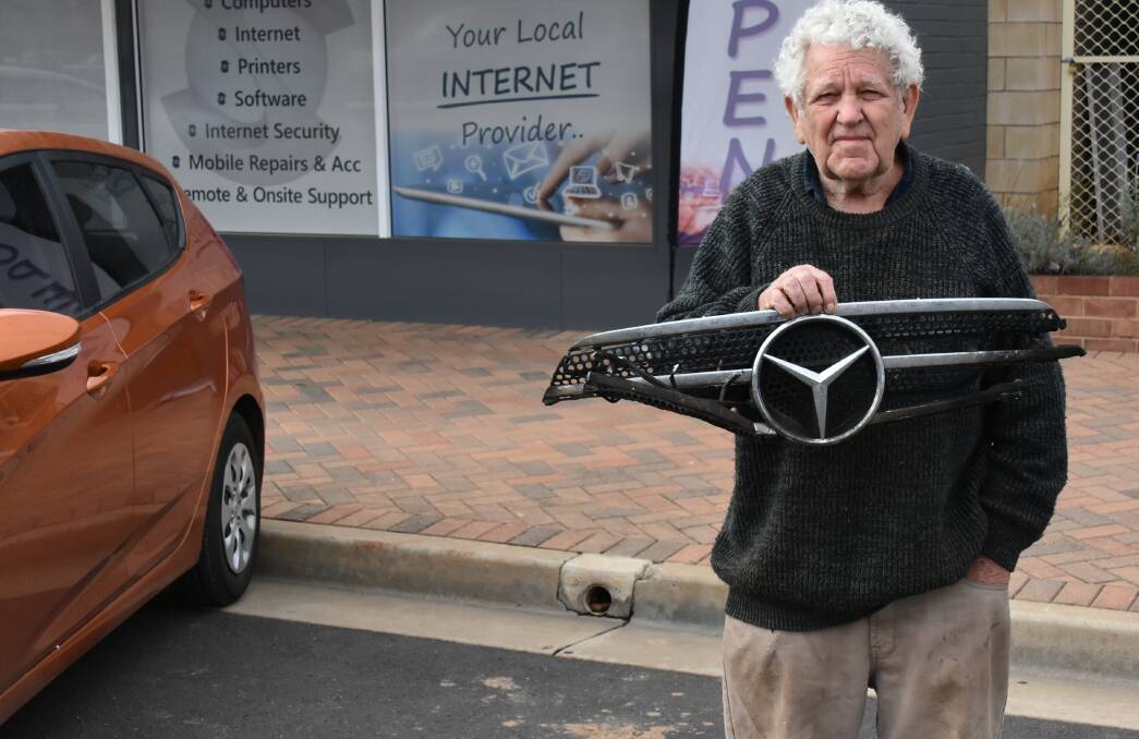 Ducky Clemens with all that he has salvaged from his stolen and burnt out Mercedes.