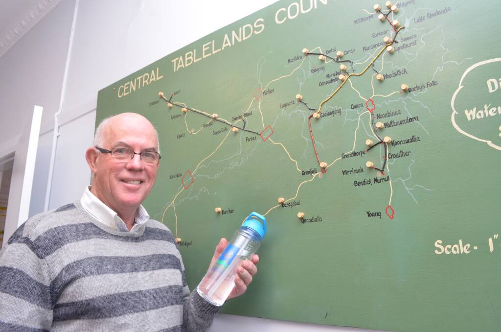 Cr David Somervaille with a map of the 14 towns Central Tablelands Water supplies with drinking water. Photo: DECLAN RURENGA