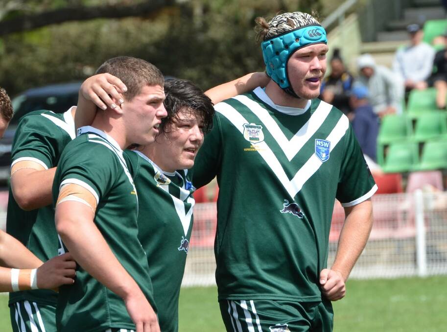 STICKING TOGETHER: Jack Hartwig (centre) during the Rams' fourth group game in Blayney. He's 'disappointed' he won't be able to take part in the Laurie Daley Cup finals. 